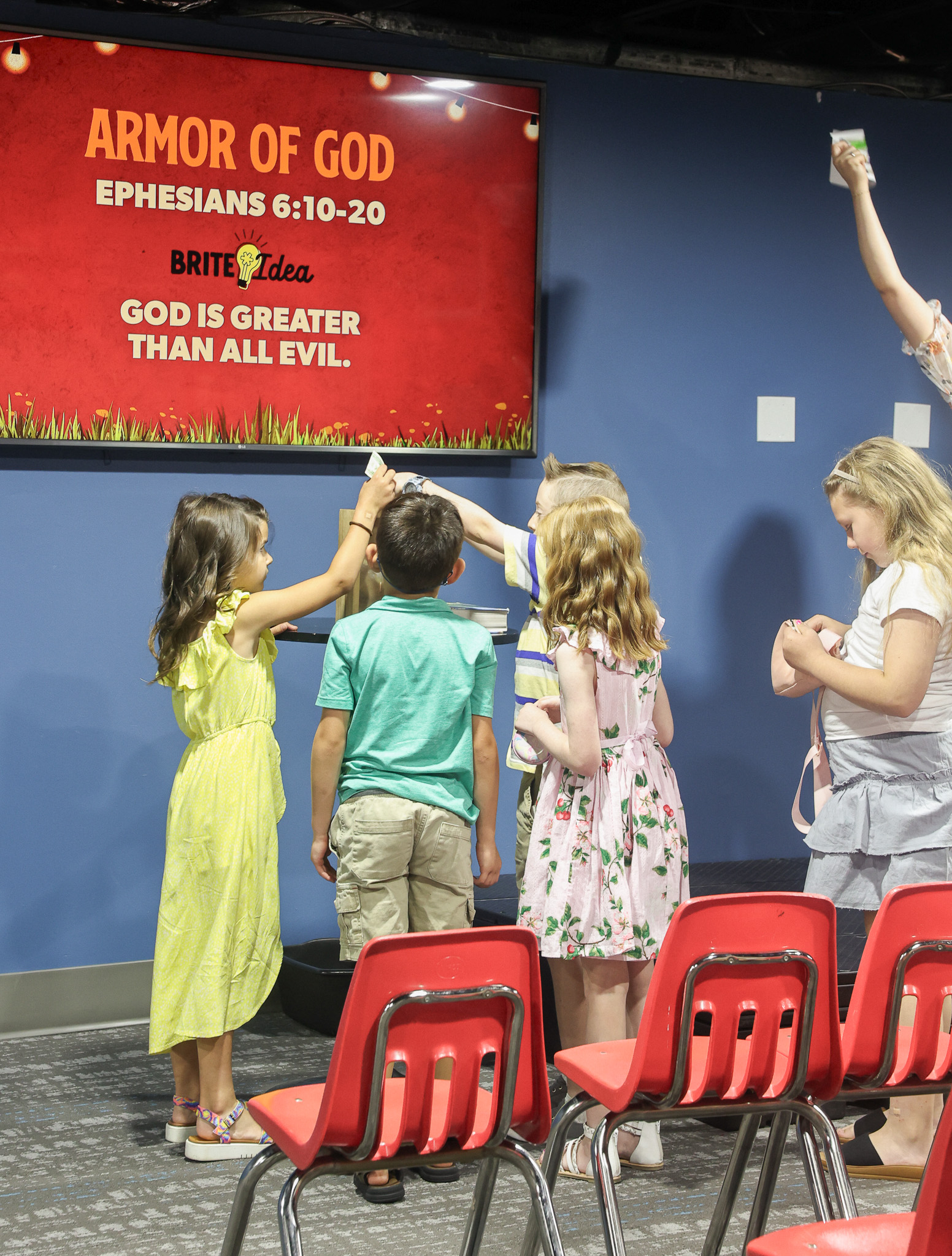 ECM Kid Praying with Teacher - Rejoice Church